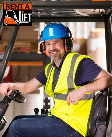 Man smiling sat in a forklift truck